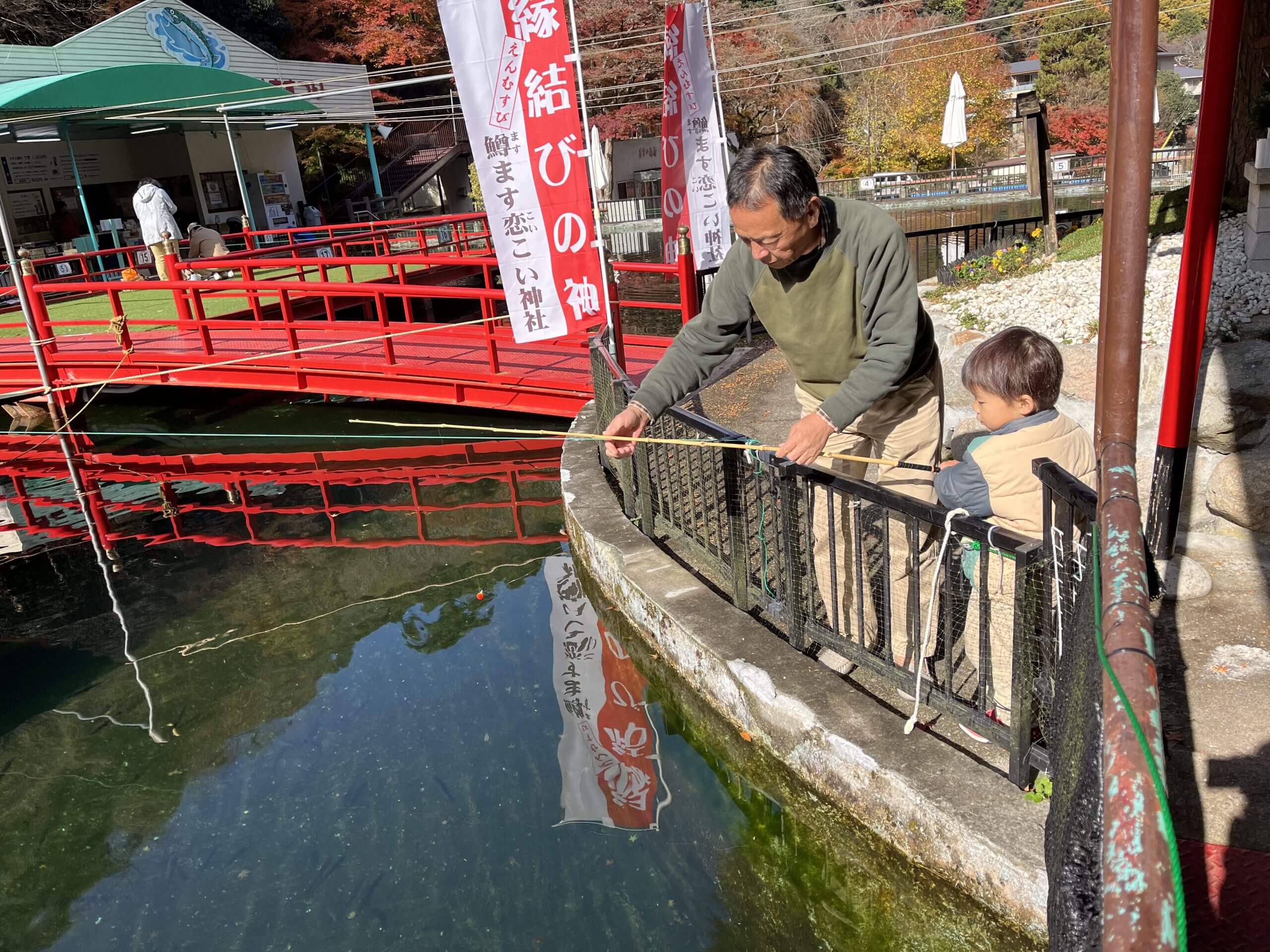 A family catching trout at Arima Trout Pond