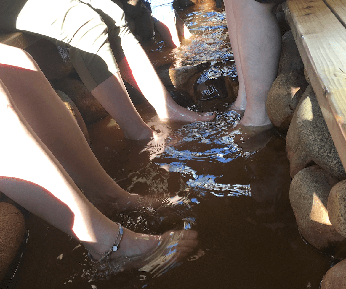 Visitors enjoying the warm foot baths in Arima Onsen