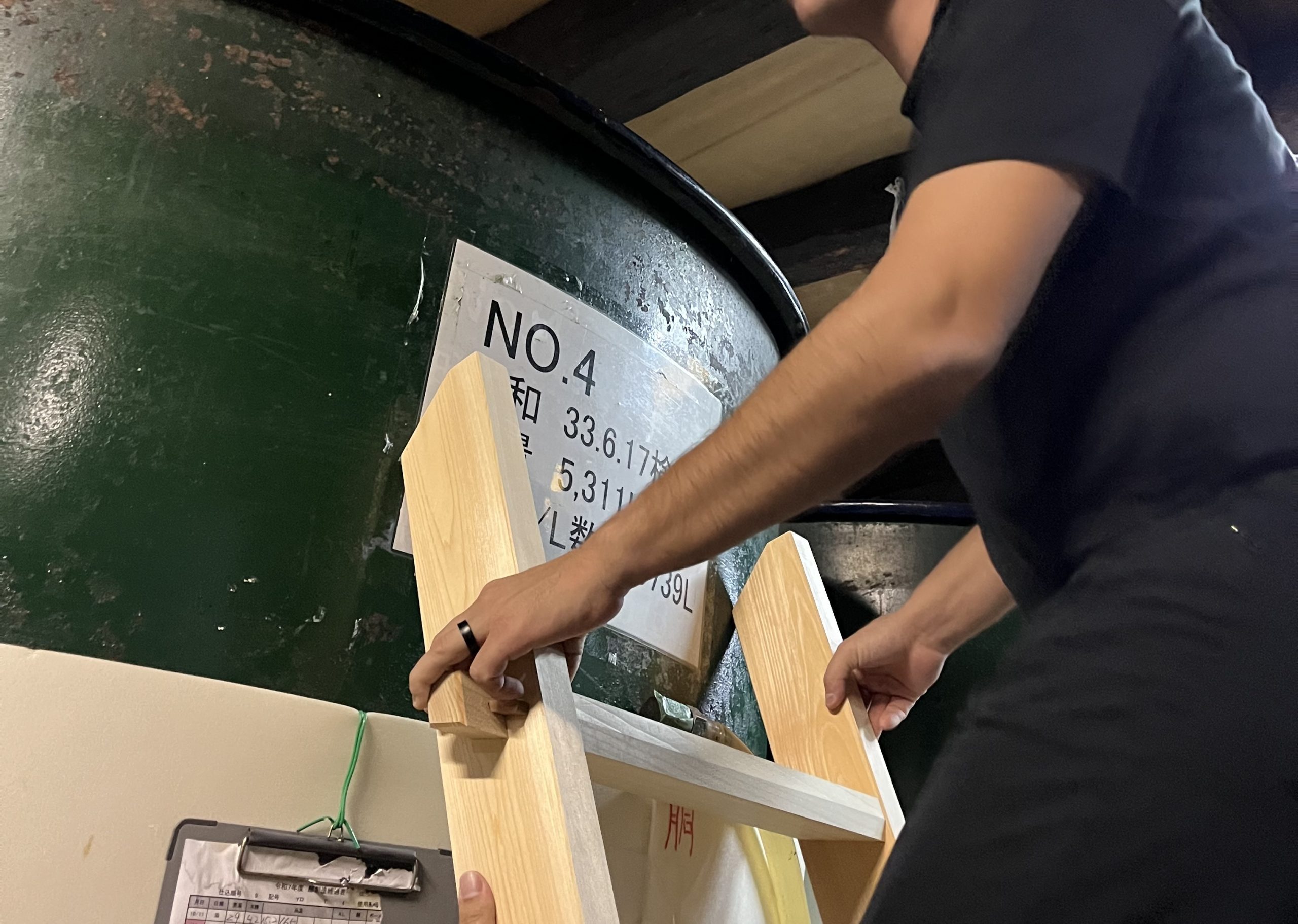 Large sake fermentation tanks inside Sasaki Brewery