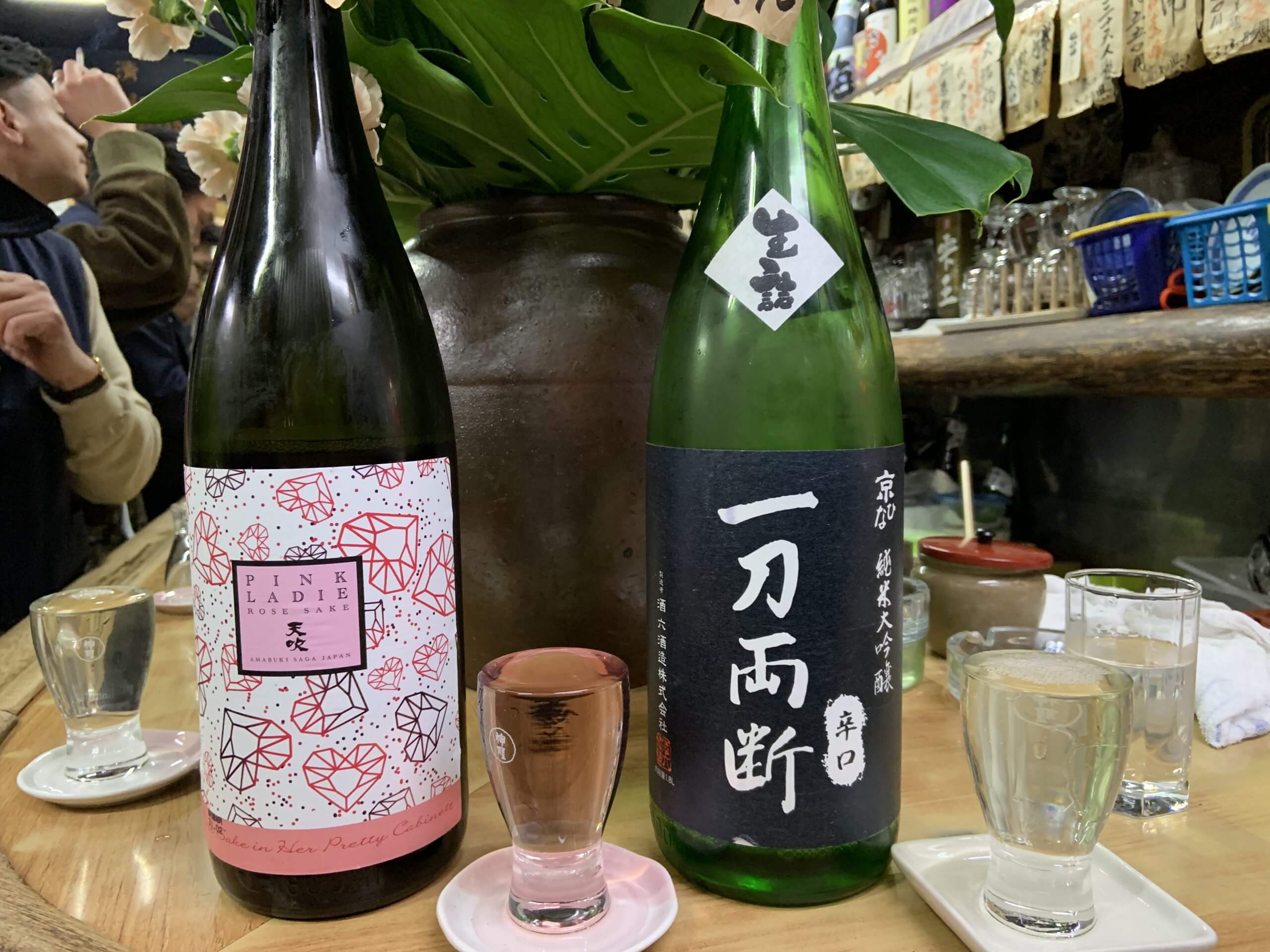 Drinks on a table in a Japanese izakaya with a casual atmosphere