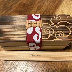 traditional cedar wood bento box with chopsticks and elastic band in Japan
