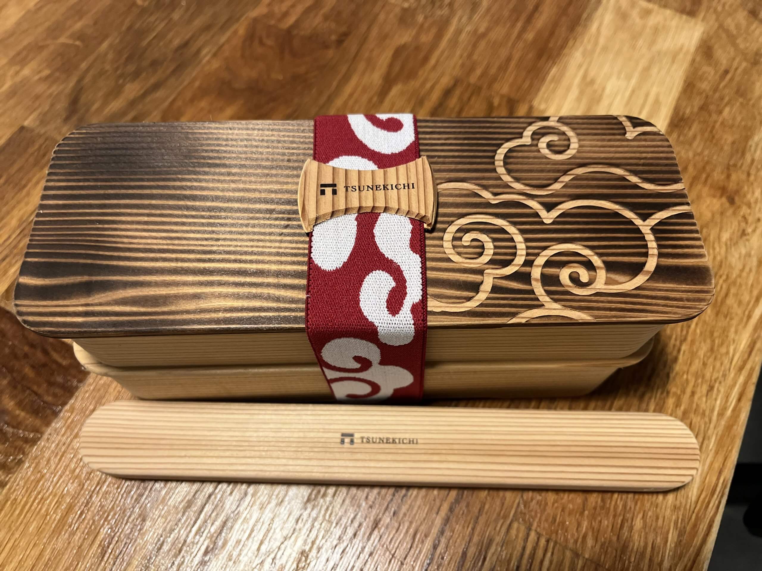 traditional cedar wood bento box with chopsticks and elastic band in Japan