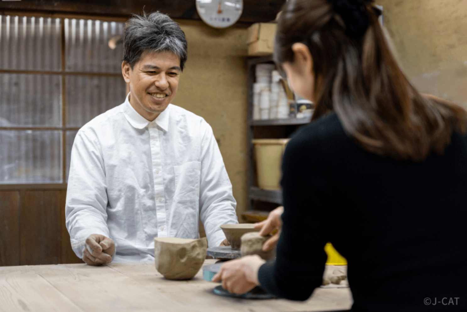 Pottery master teaching a hands-on Shigaraki pottery workshop at Miharugama