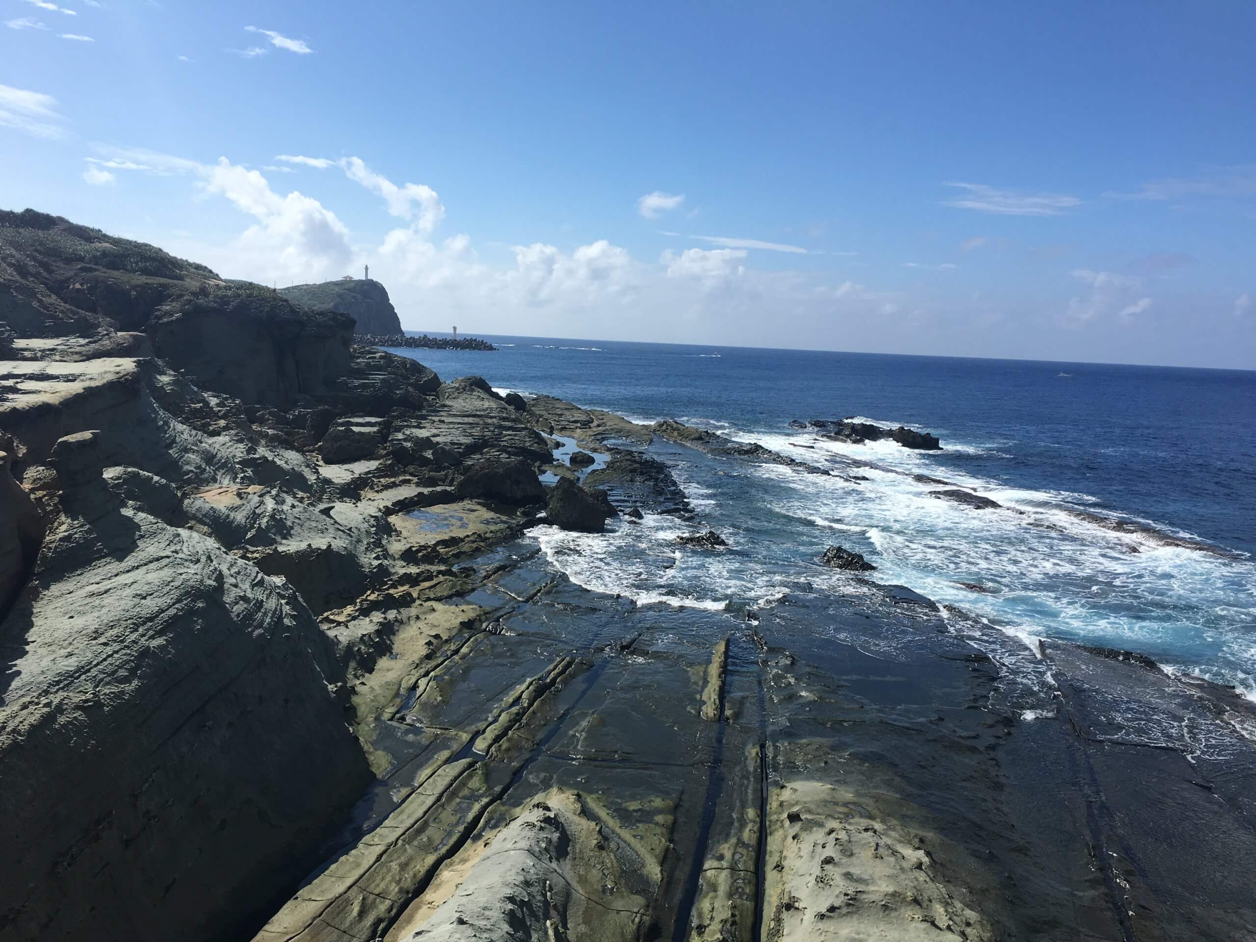 Ocean surface above Yonaguni underwater rock formations diving site